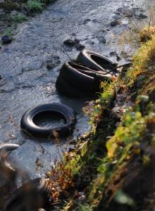 tyres in the woodland stream